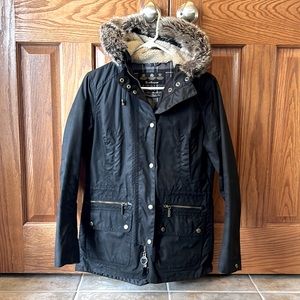 Barbour wax jacket with fur lined hood.